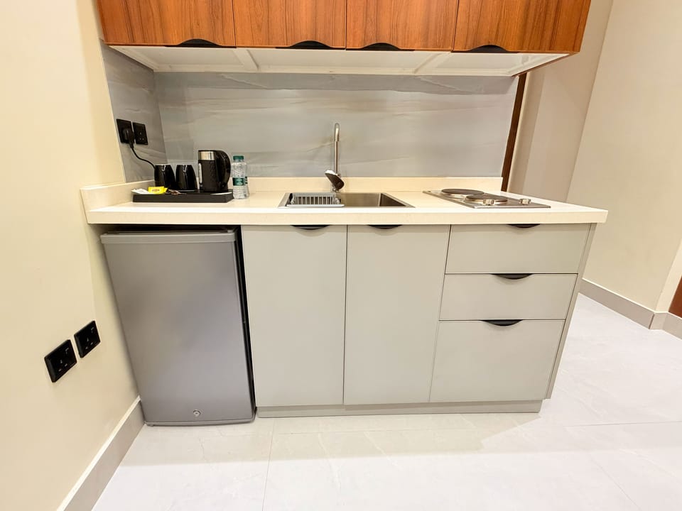Apartment | Private kitchen | Mini-fridge, microwave, stovetop, cookware/dishes/utensils