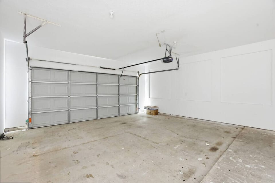 Spacious two-vehicle garage, perfect for cars, bikes, or travel gear.