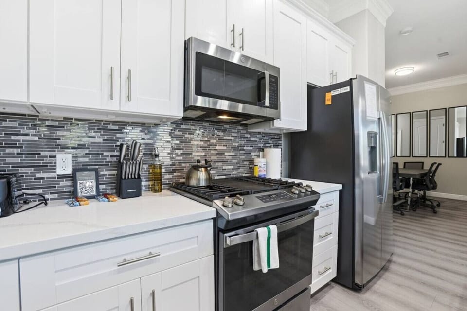 Fully appointed cooking area with stainless appliances, gas range, and ample prep space—suited for everything from simple snacks to full dinners.