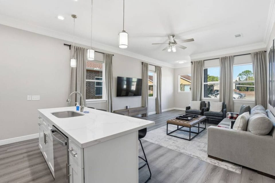Open-concept layout blending kitchen and lounge areas, filled with natural light and modern finishes—great for gathering, relaxing, or enjoying time together.