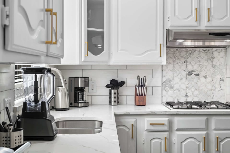 Fully equipped kitchen with modern appliances and ample counter space.