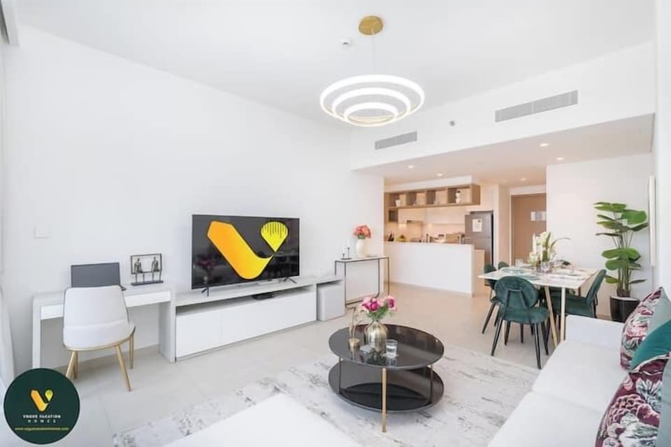 Luxury Apartment, Balcony, City View | Living area | 65-inch Smart TV with cable channels
