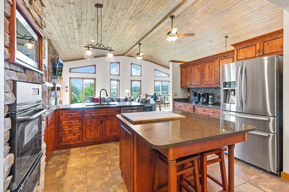 Kitchen overlooking living room and onto views in the distance.