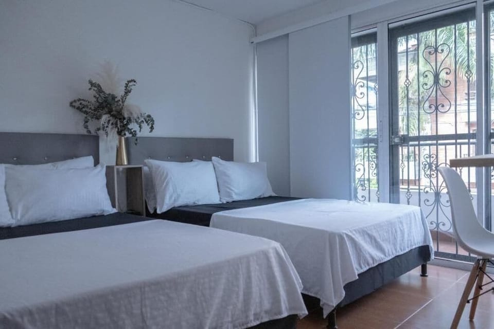Economy Double Room, Balcony, Garden View | Blackout drapes, iron/ironing board, free WiFi
