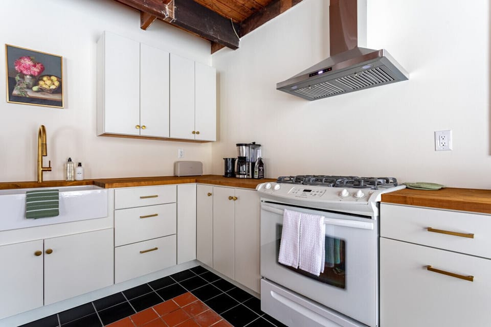 Beautiful newly renovated kitchen with new appliances and butcher block countertop
