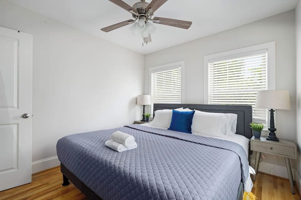 This cozy bedroom offers a large king bed, soft lighting, and tranquil decor, ensuring a restful environment.