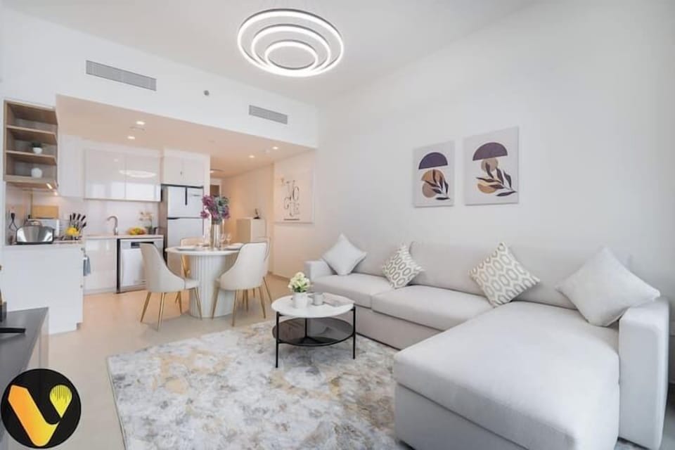 Luxury Apartment, Balcony, City View | Living area | 65-inch Smart TV with cable channels