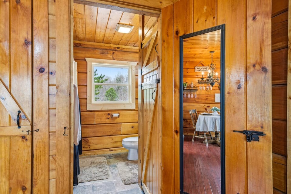 Cozy Log Bathroom | Bright Vanity & Fresh Towels