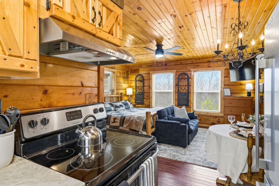 Kitchen | Stainless Appliances, Wood Cabinets & Forest Views