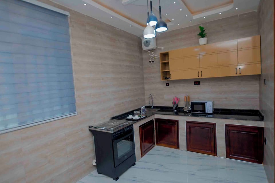 Family Apartment, 2 Bedrooms, Garden View | Private kitchen | Fridge, microwave, oven, stovetop