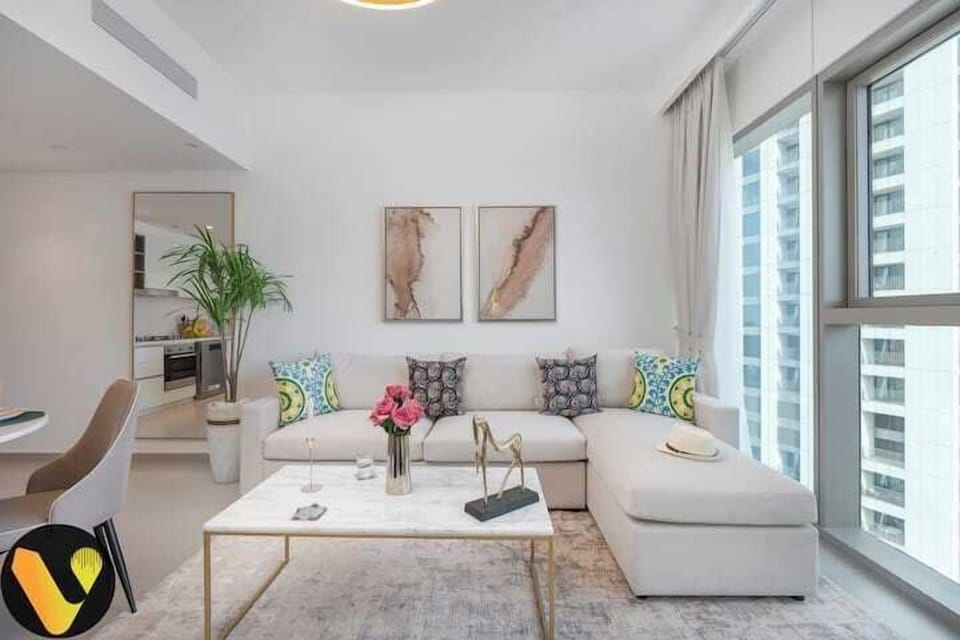 Luxury Apartment, Balcony, City View | Living area | 65-inch Smart TV with cable channels