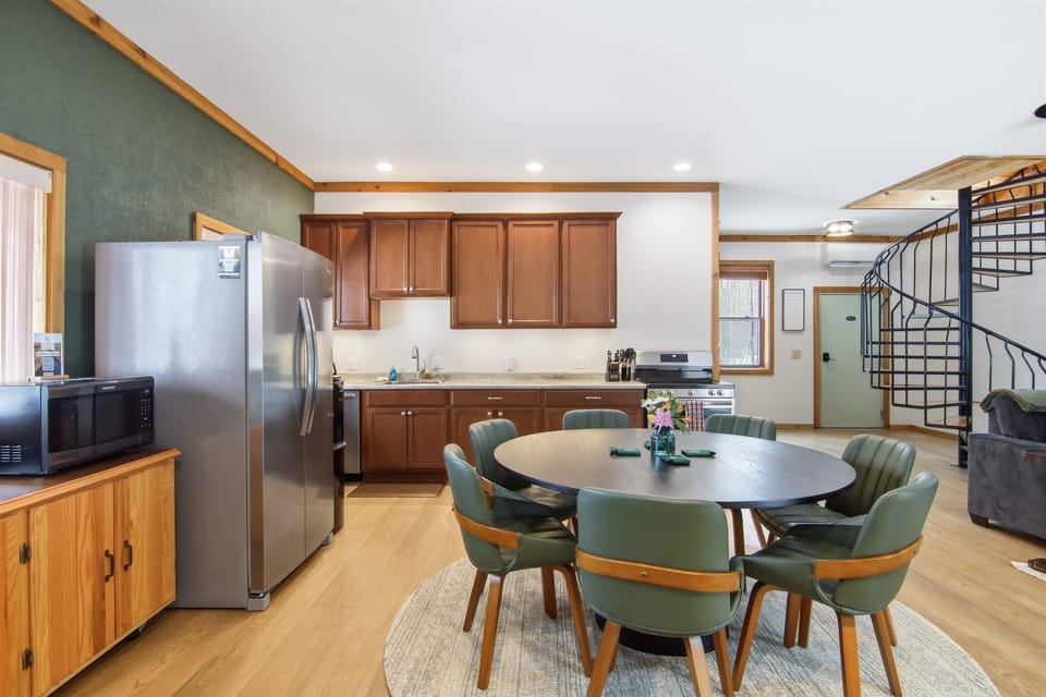 Dining room and fully stocked kitchen ready for homemade meals and memories.