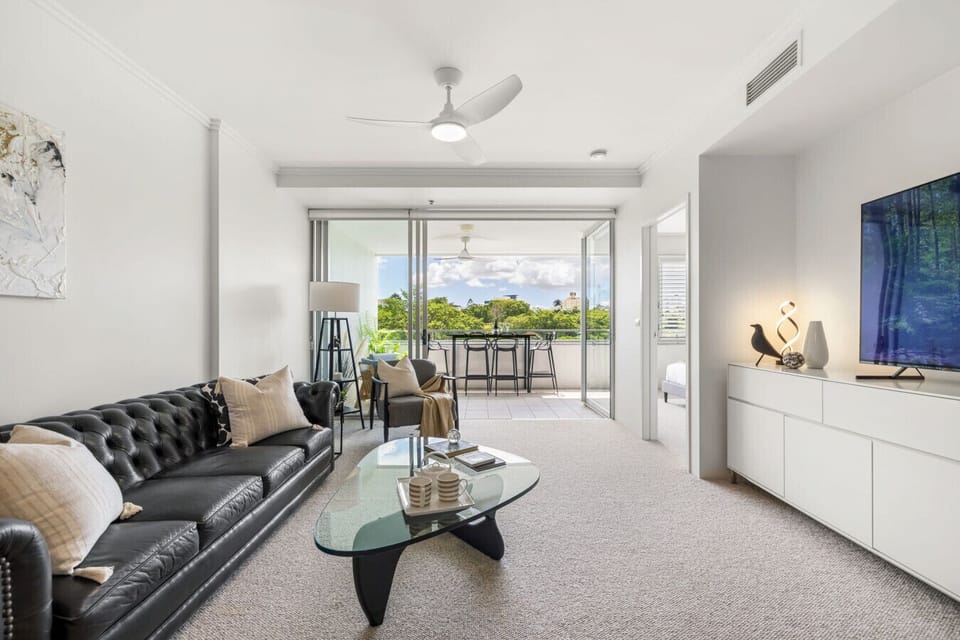 Open plan living area with balcony access