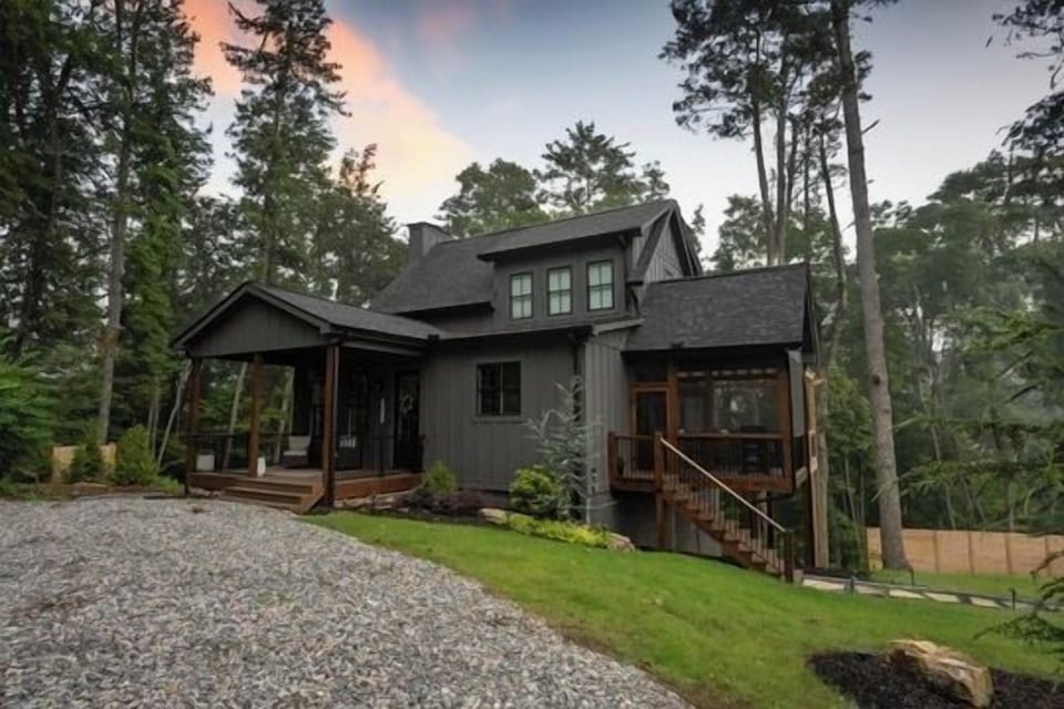 Modern forest retreat with covered porch and serene wooded setting