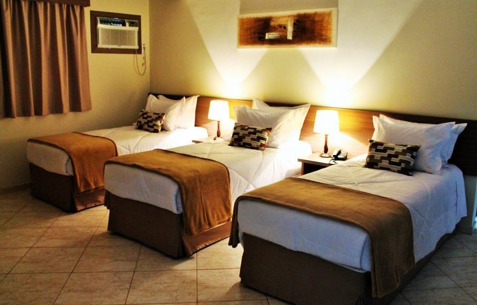 Luxury Triple Room | Minibar, in-room safe, individually furnished, desk