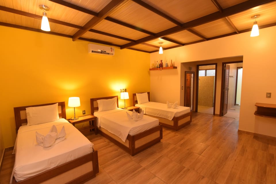 Standard Triple Room, 1 Bedroom | Minibar, in-room safe, free WiFi, bed sheets