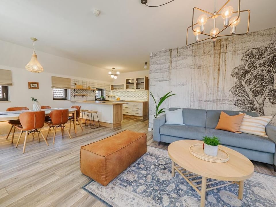 Deluxe Suite, Lake View | Living area | TV