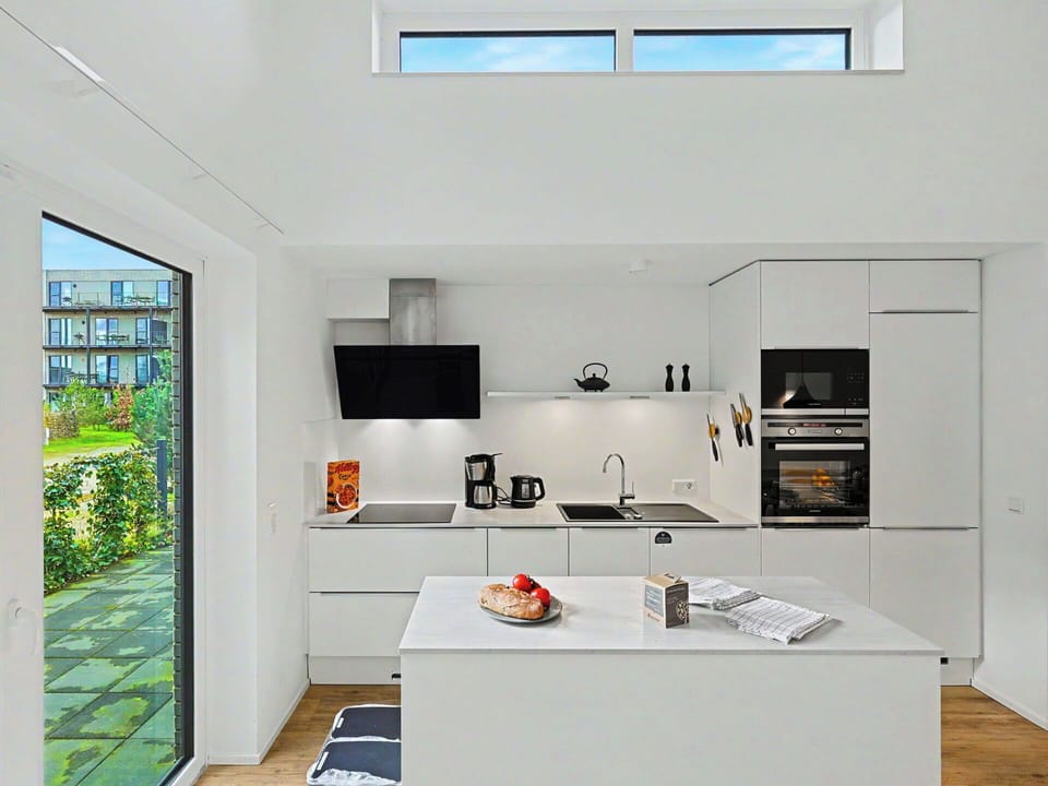 Kitchen, Countertop, Kitchen Appliance, Interior Design, Flooring, Furniture, Cabinetry, Wood, Floor, Major Appliance