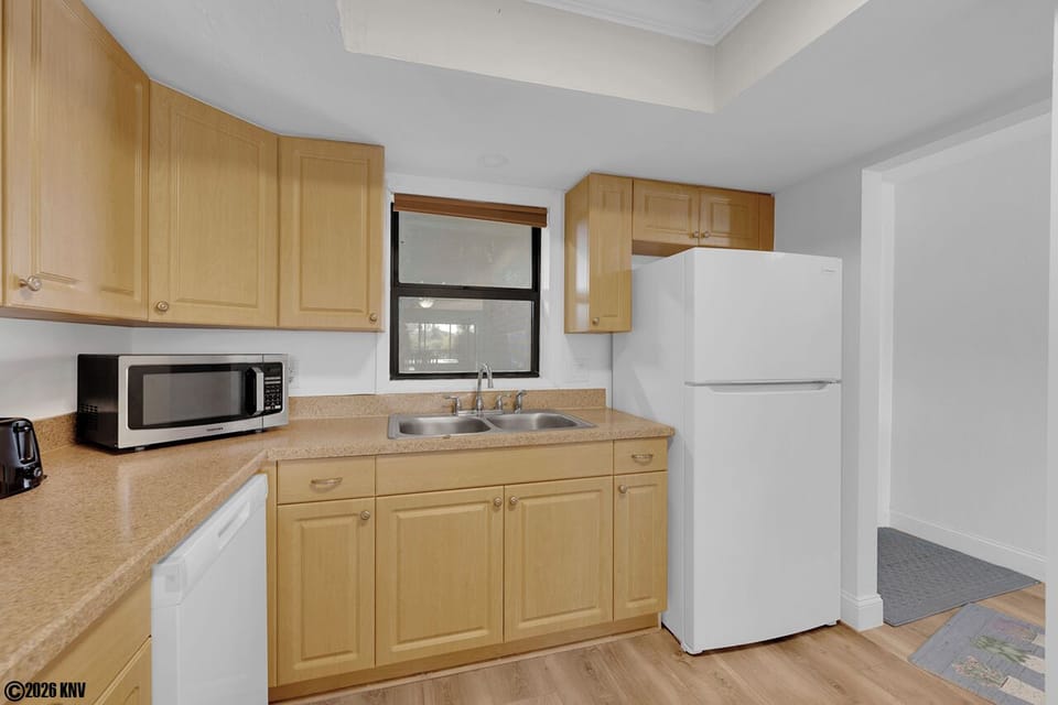 Kitchen has all appliances including a dishwasher.