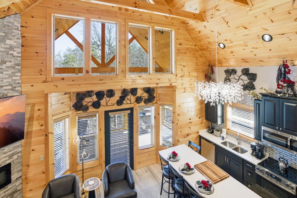 Cabin in Pigeon Forge with a Bowling Alley "Let The Good Times Roll" - Living room, dining area, and kitchen