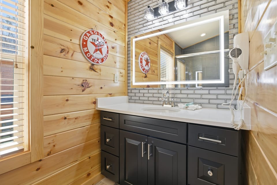 Pigeon Forge Vacation Rental "Let The Good Times Roll" - Upper level bathroom with heated and lit mirror