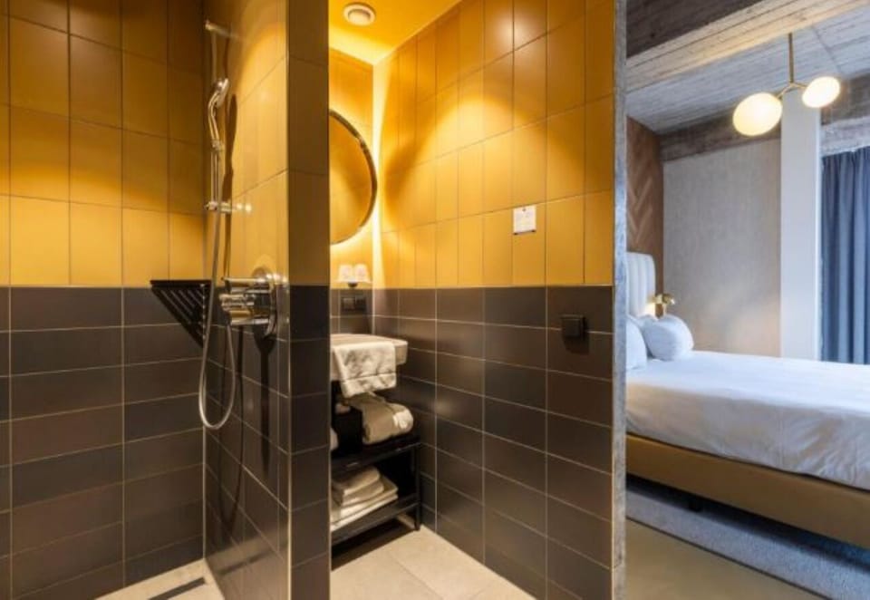 Rinse off comfortably with rainfall-style shower and warm lighting.