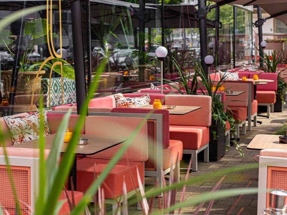 Soak up fresh air on the chic patio with cushioned seating.