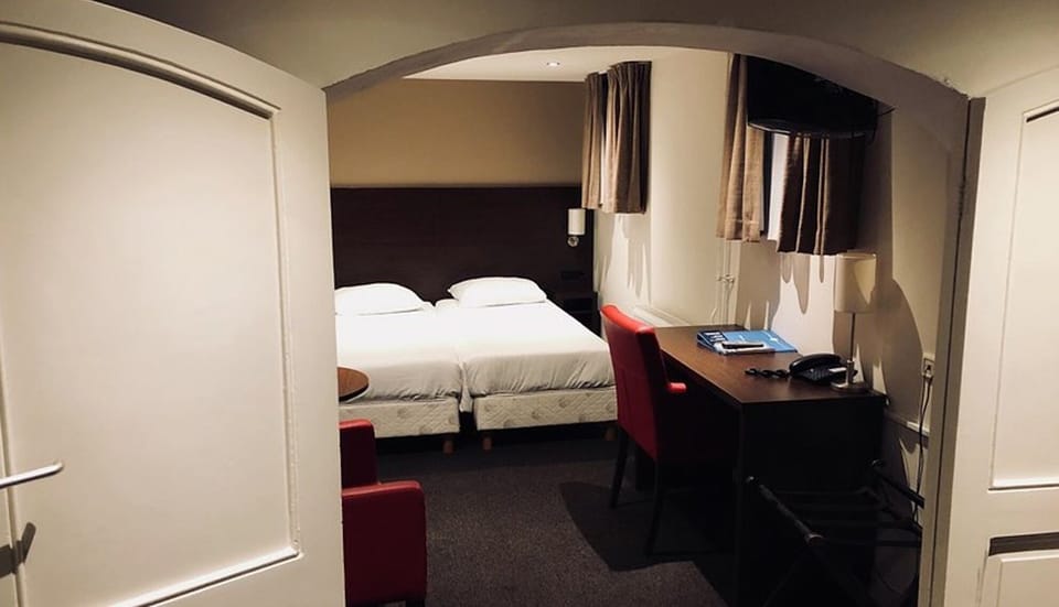 Settle in with a comfortable workspace beside your bed.