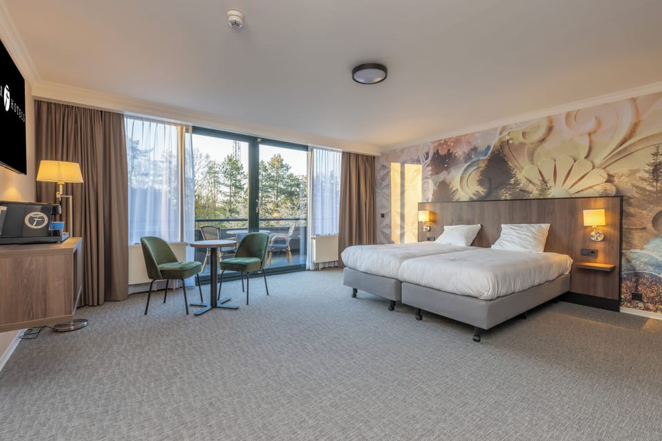 Relax in a bright king room with balcony seating.