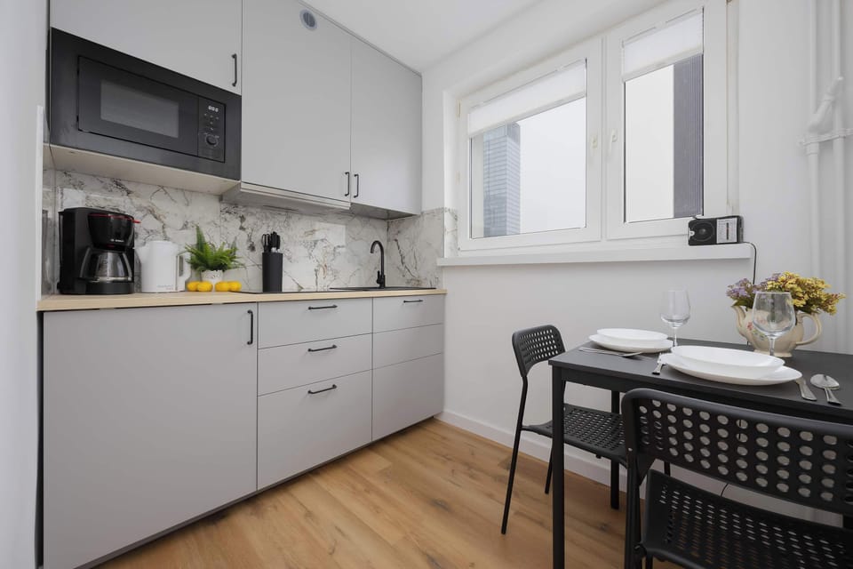 Functional kitchenette with full cabinetry and efficient layout for everyday cooking.
