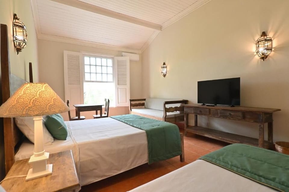 Deluxe Quadruple Room, Garden View | Room amenity