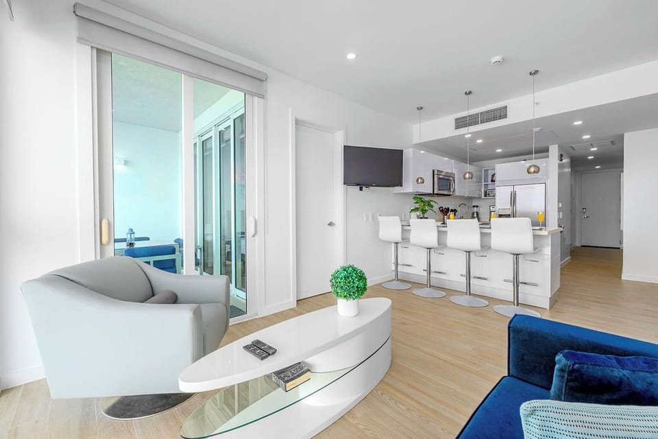 Relax in your stunning open-concept space where modern elegance meets comfort, featuring sleek furnishings and access to your private balcony.