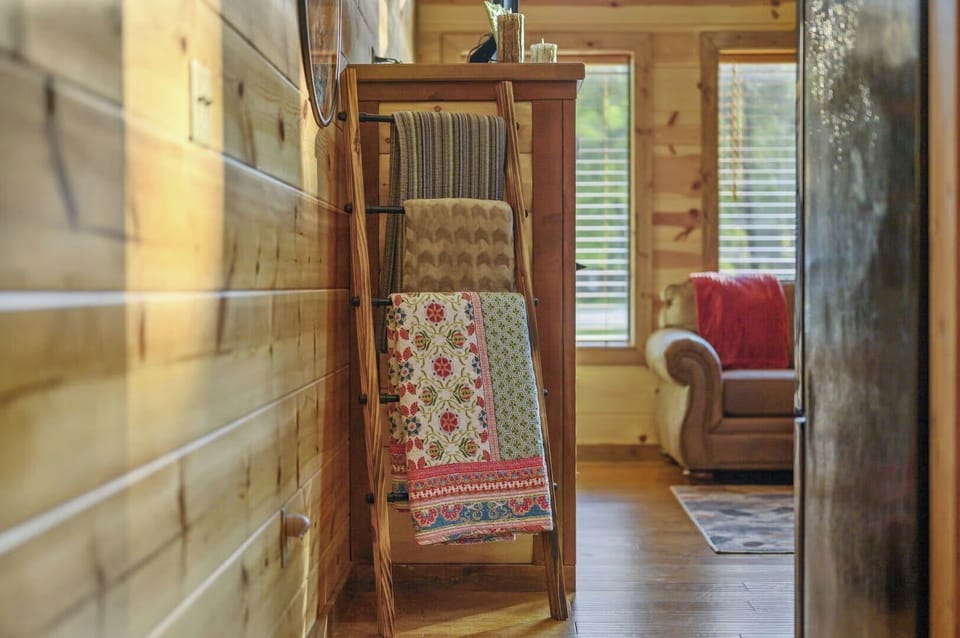 Cozy cabin charm surrounds you with handcrafted wooden details, colorful quilts, and rustic warmth perfect for your mountain retreat.