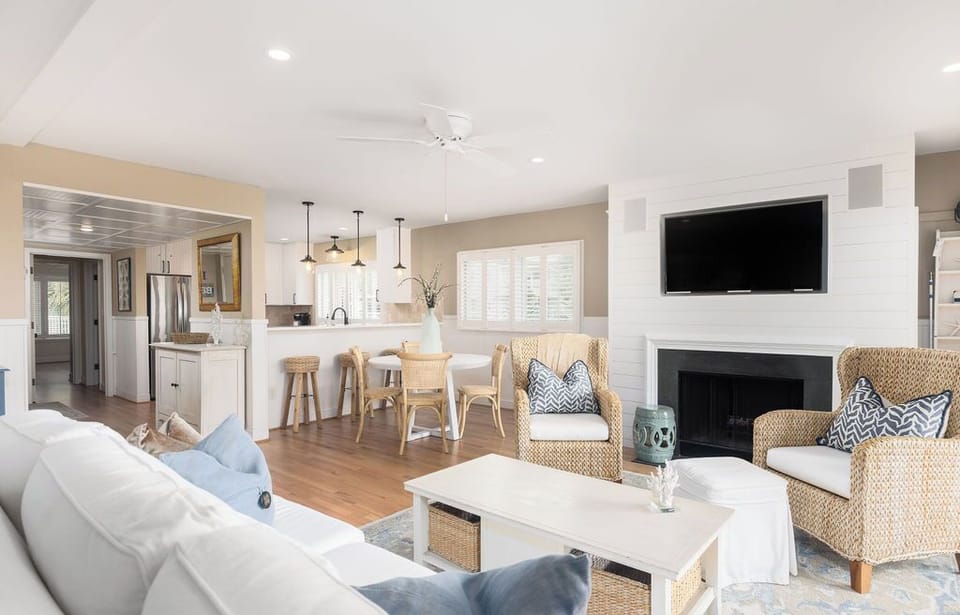 The living and dining area flows into the kitchen, and the ocean view can be enjoyed from everywhere.