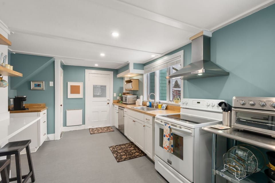 Fully-equipped kitchen with modern appliances.