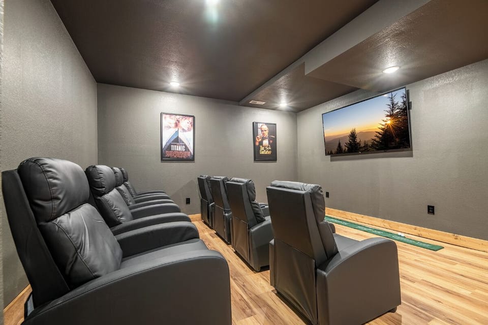 Sink into luxurious theater seating for your private movie nights, complete with stadium-style leather recliners and ambient lighting.