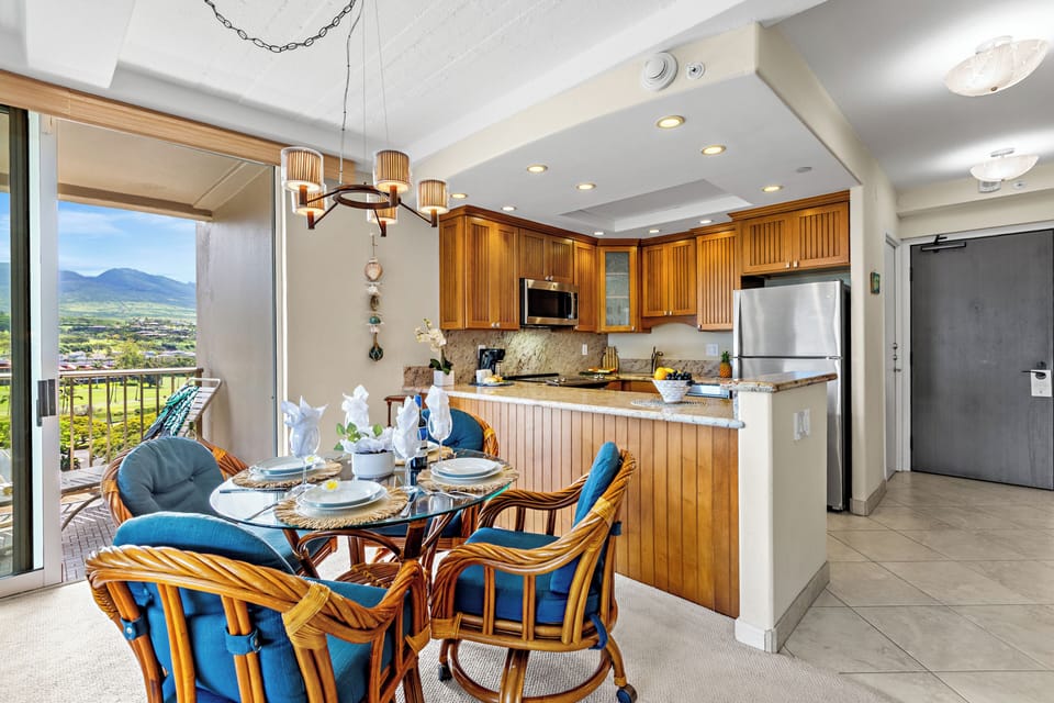 You'll love preparing meals in this bright kitchen while enjoying stunning mountain views through floor-to-ceiling windows.