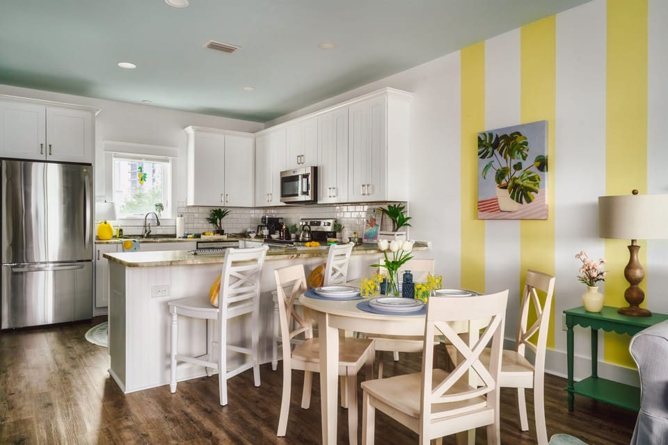 Bright, airy, and fully equipped. Whether you’re whipping up a beachside brunch or just brewing your morning roast, this sleek white kitchen makes every meal feel like a celebration.