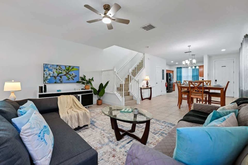 Spacious living room with smart TV and comfy seating