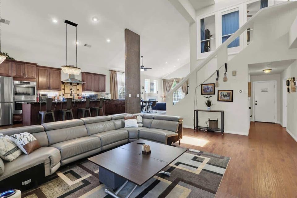 Kick back and relax in the cozy living room with plush seating and a 60” smart TV.