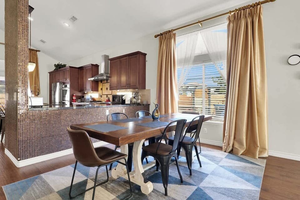 Gather around the dining table, plenty of space for meals and memories.