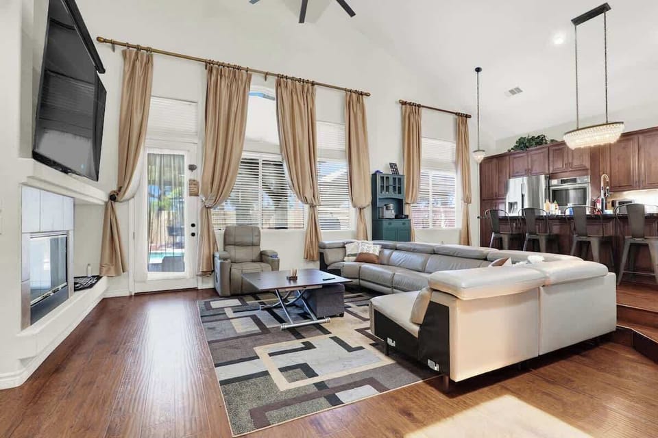 Kick back and relax in the cozy living room with plush seating and a 60” smart TV.