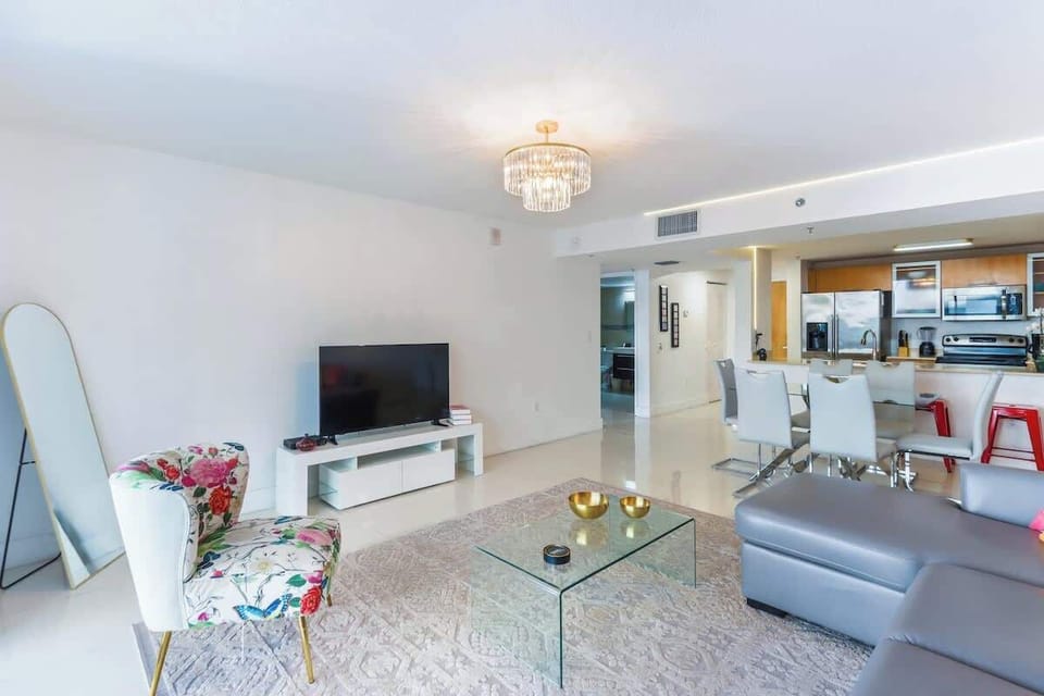 Modern open concept living space featuring a cozy sofa bed.