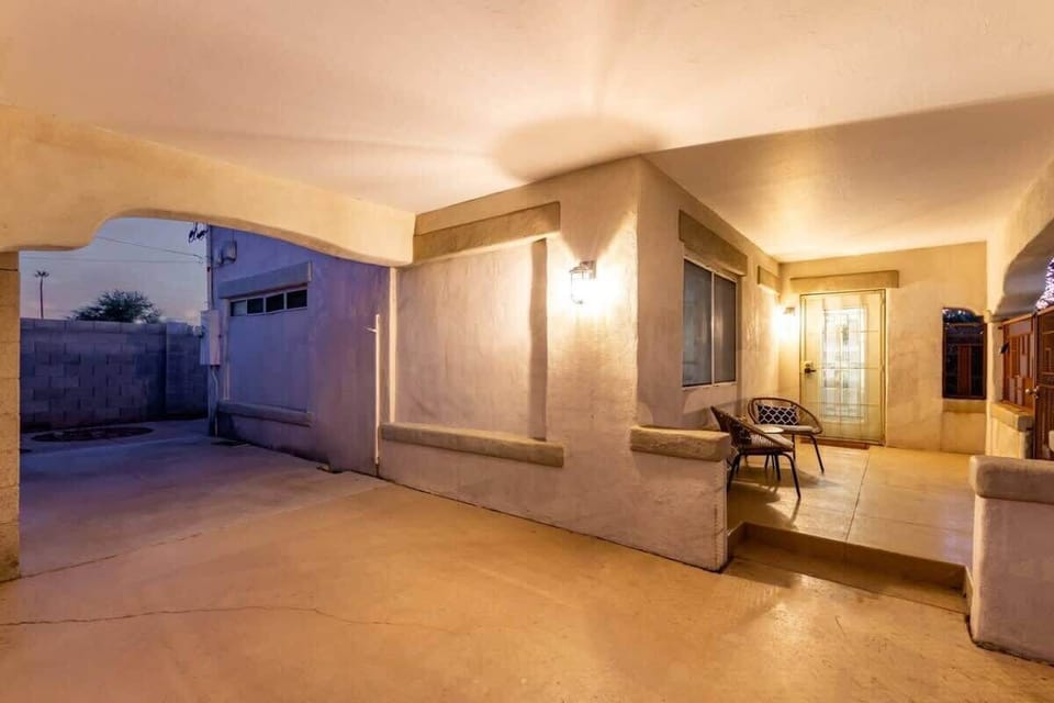 Welcoming entry with desert-style charm and a cozy front vibe, step inside to your modern Phoenix retreat with private driveway parking right out front.