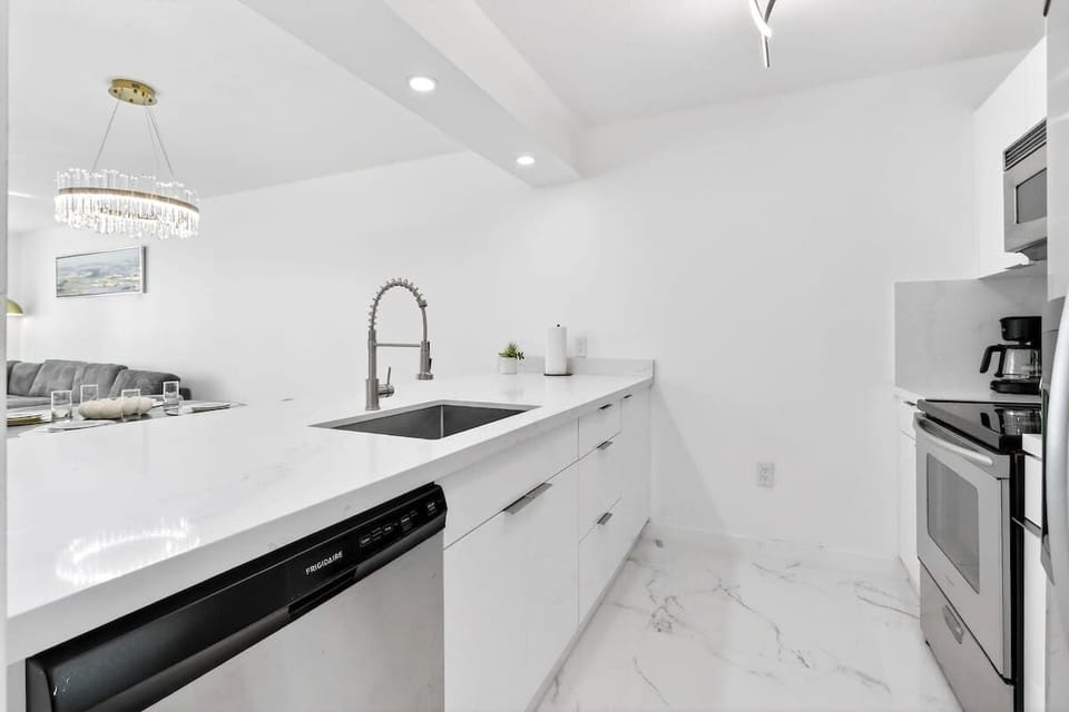 Fully stocked kitchen with modern appliances and everything you need to cook with ease.