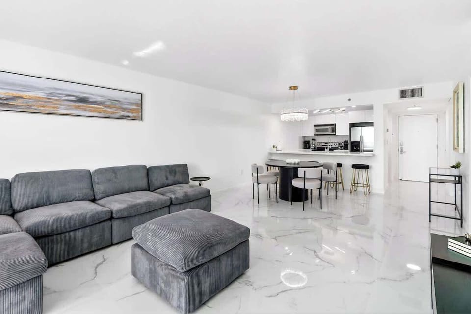 Bright and modern living room with comfortable seating and Smart TV.