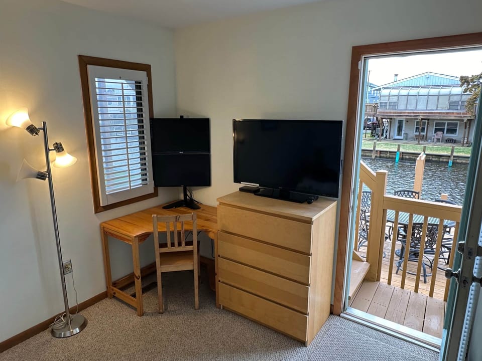 111 - Work station with dual-monitors and canal view