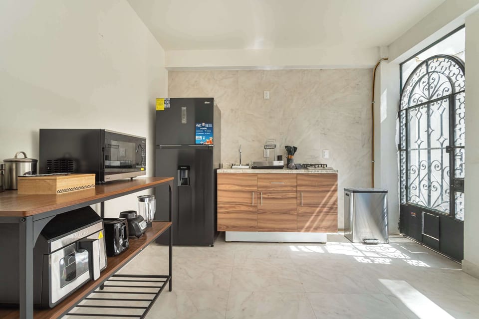 Prepare delicious meals in our fully equipped kitchen with modern appliances.