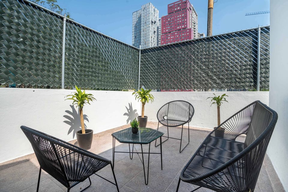 Private outdoor patio with comfortable seating, ideal for relaxing.