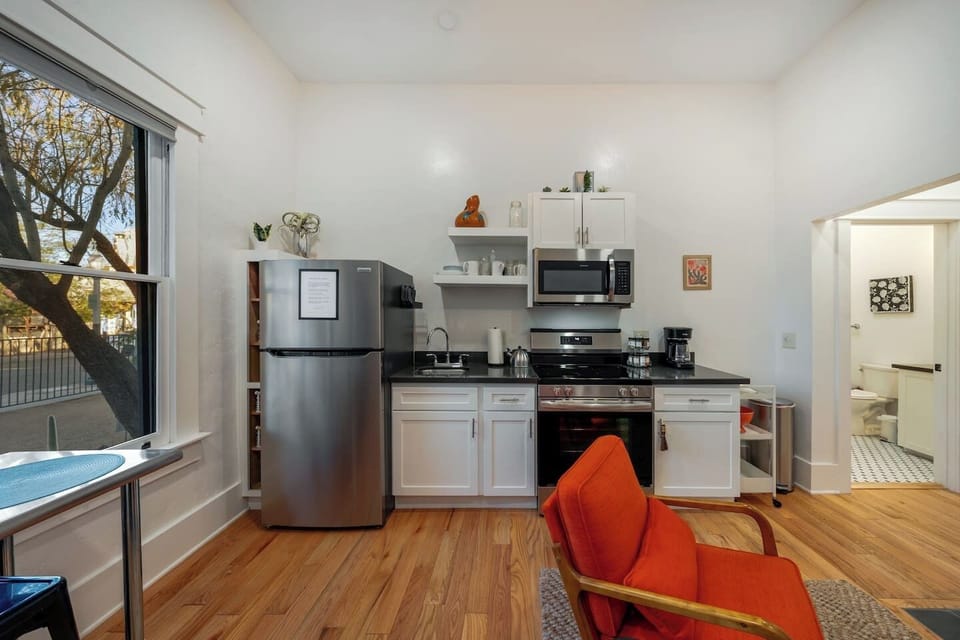 UNIT #1: Small but mighty kitchen area with fridge, range/oven, and microwave (no dishwasher)